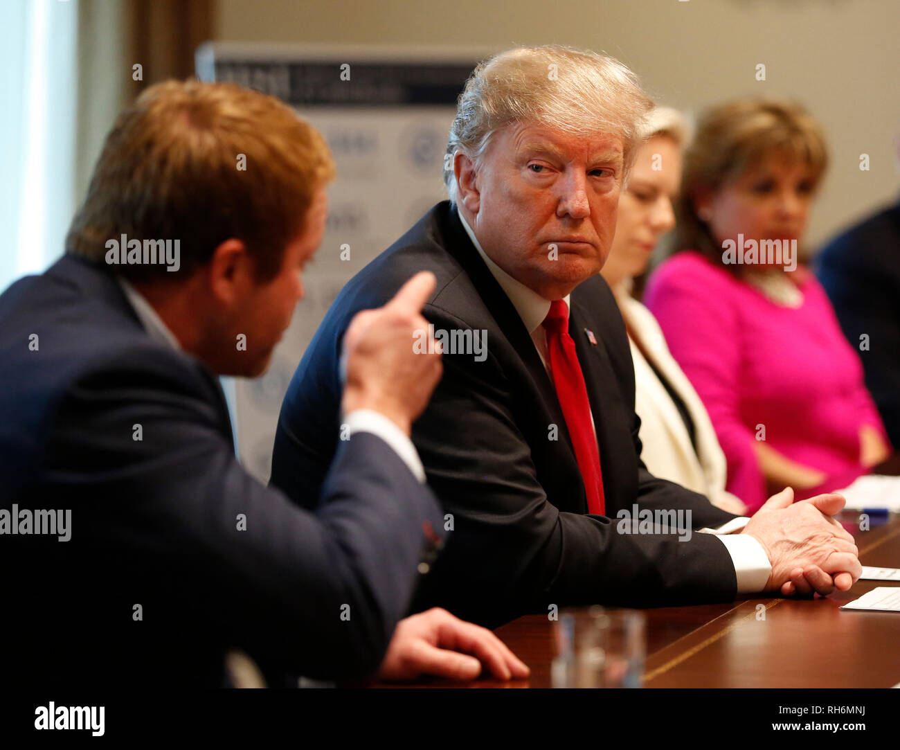 Washington, United States Of America. 01st Feb, 2019. United States President Donald J. Trump listens to Timothy Ballard, Operation Underground Railroad Founder and CEO, discuss fighting human trafficking on the southern border during a meeting in the Cabinet Room of the White House, in Washington, DC, February 1, 2019. Credit: Martin H. Simon/CNP | usage worldwide Credit: dpa/Alamy Live News Stock Photo