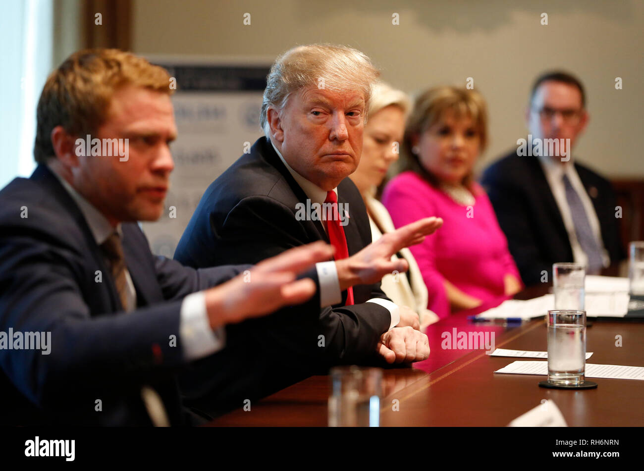 Washington DC, USA. 01st Feb, 2019. United States President Donald J. Trump listens to Timothy Ballard, Operation Underground Railroad Founder and CEO, discuss fighting human trafficking on the southern border during a meeting in the Cabinet Room of the White House, in Washington, DC, February 1, 2019. Credit: Martin H. Simon/CNP /MediaPunch Credit: MediaPunch Inc/Alamy Live News Stock Photo