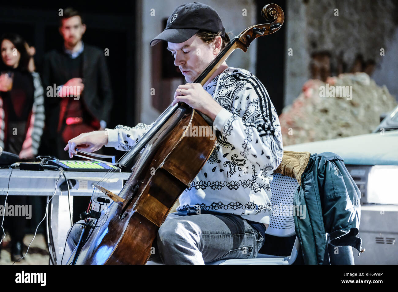 Turin, Italy. 31st Jan, 2019. The performance of the cellist Oliver Coates,  between Mike Nelson's "Atteso" installation at binary 1 of the OGR-  Officine Grandi Riparazioni in Turin Italy Credit: Bruno Brizzi/Pacific