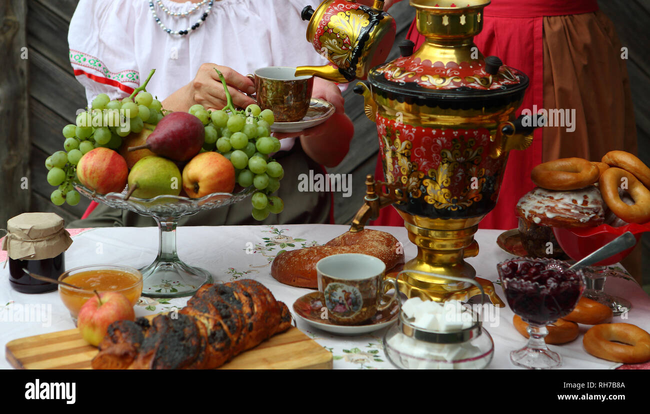Still life with a samovar, tea and sweet pastries Stock Photo - Alamy