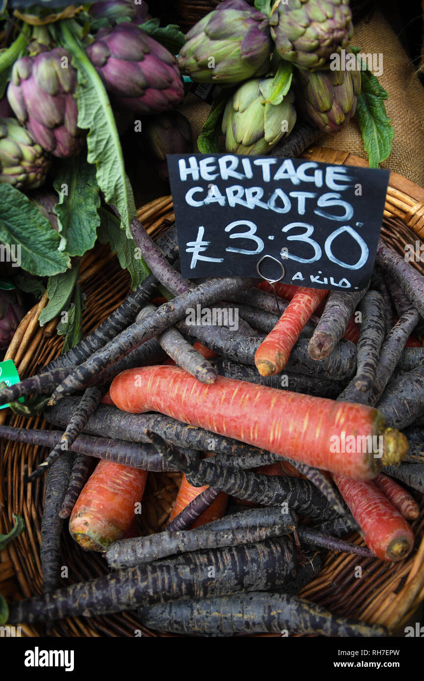 A Basket of Heritage Carrots in Borough Market in London Stock Photo