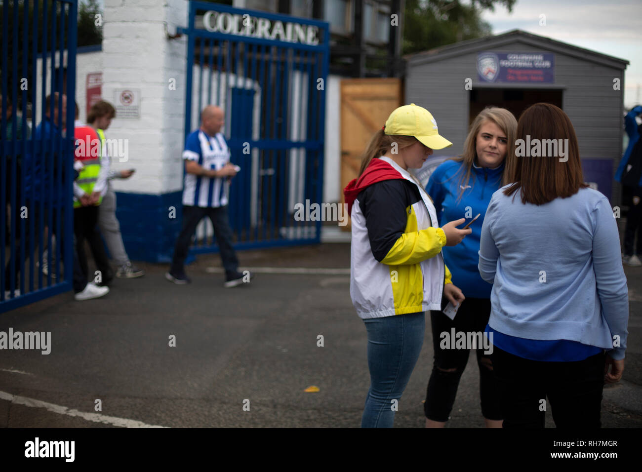 Home supporters arriving at the stadium before Coleraine played Spartak Subotica of Serbia in a Europa League Qualifying First Round second leg at the Showgrounds, Coleraine. The hosts from Northern Ireland had drawn the away leg 1-1 the previous week, however, the visitors won the return leg 2-0 to progress to face Sparta Prague in the next round, watched by a sell-out crowd of 1700. Stock Photo