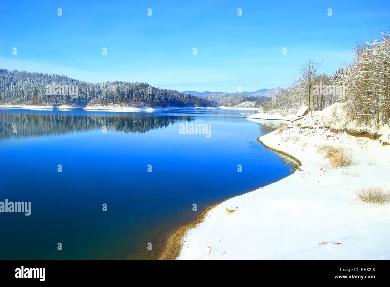 Winter landscape; Blue lake covered with snow, Gorski katar, Croatia Stock Photo