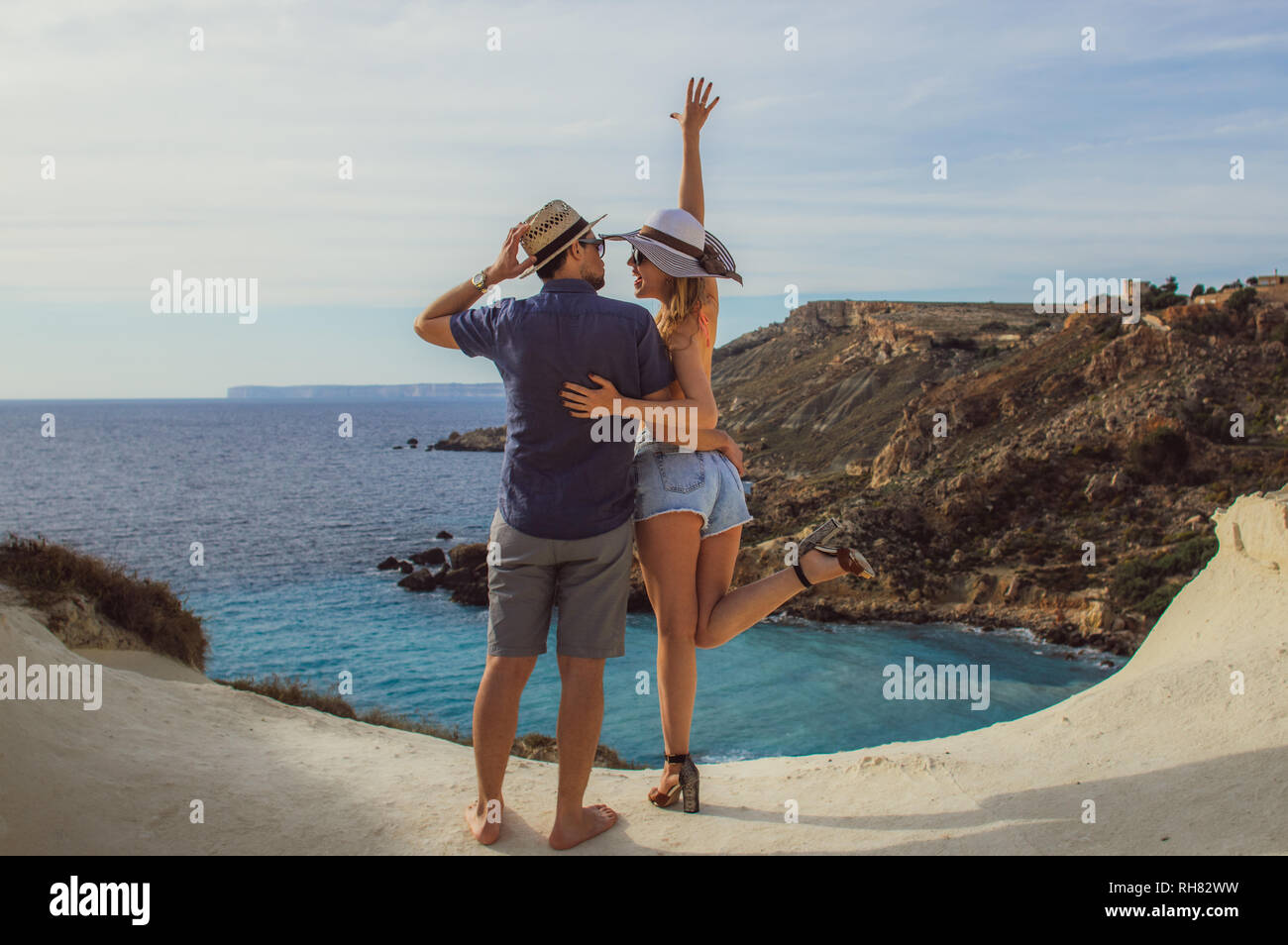 Couple embrace in the day on the seaside, beautiful view to sea Stock Photo