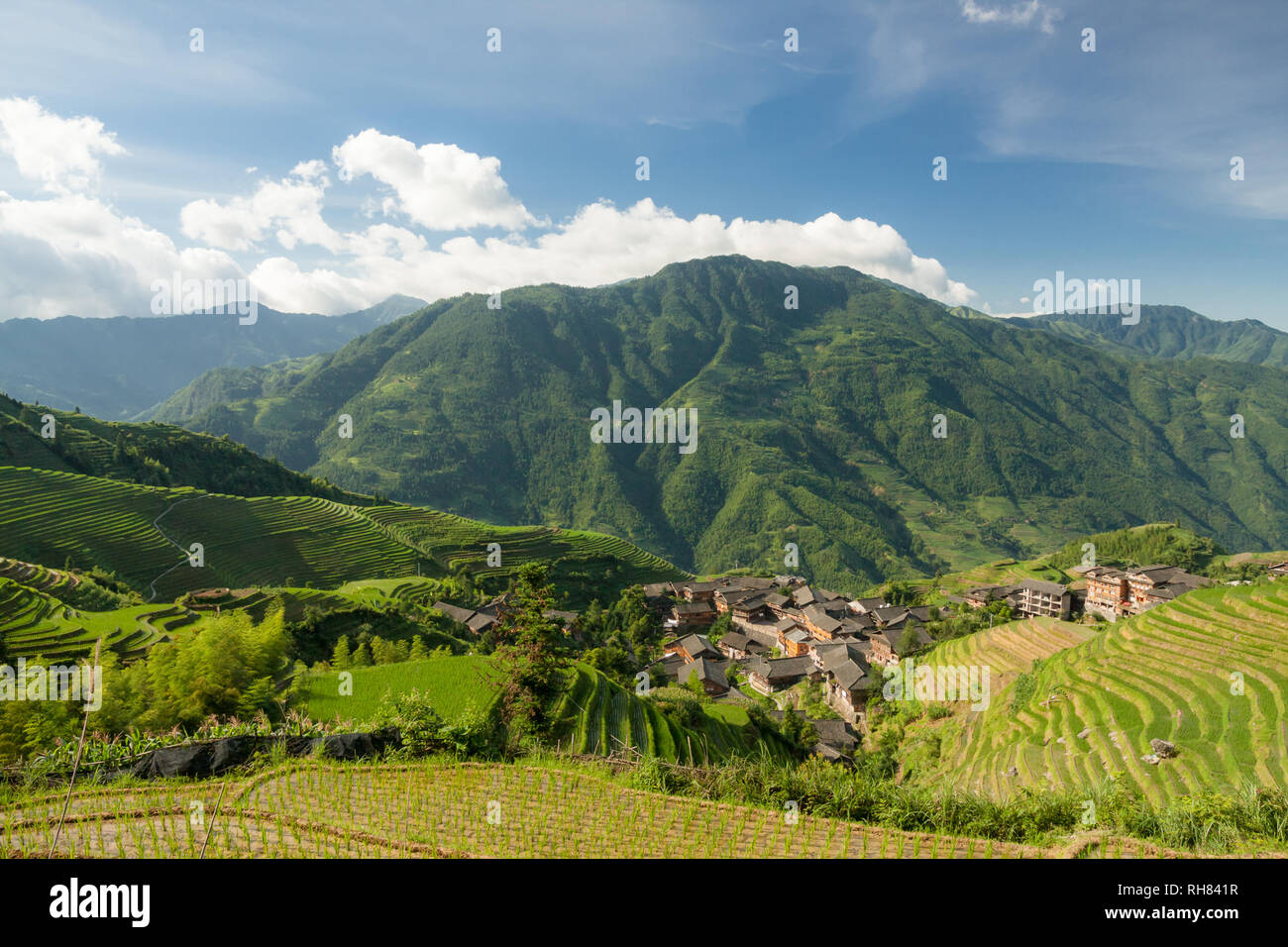 Rice terraces landscape and village in china Stock Photo - Alamy