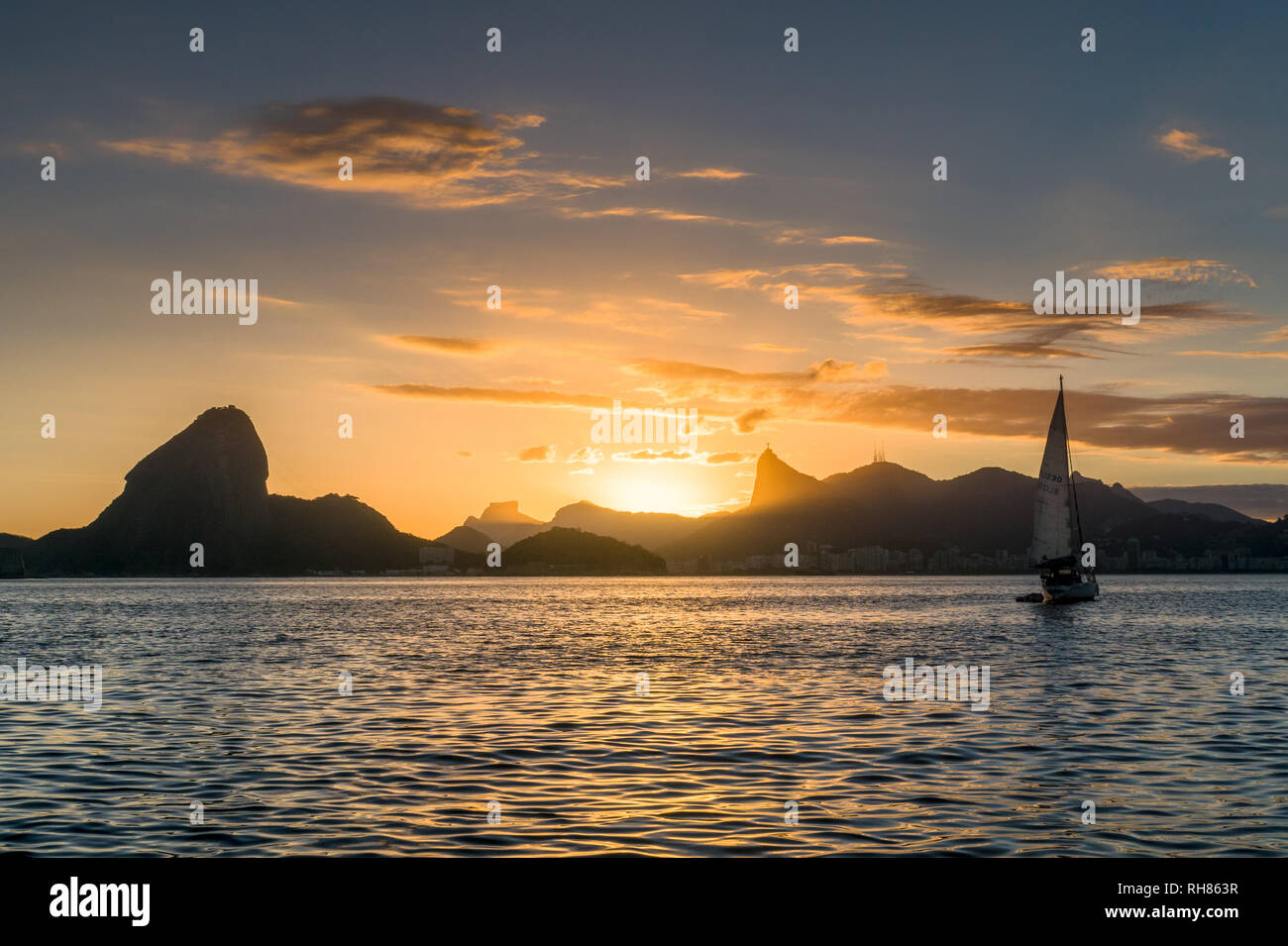 the iconic view of Rio de Janeiro from a sailing ship at Sunset. Does it get any better? Stock Photo