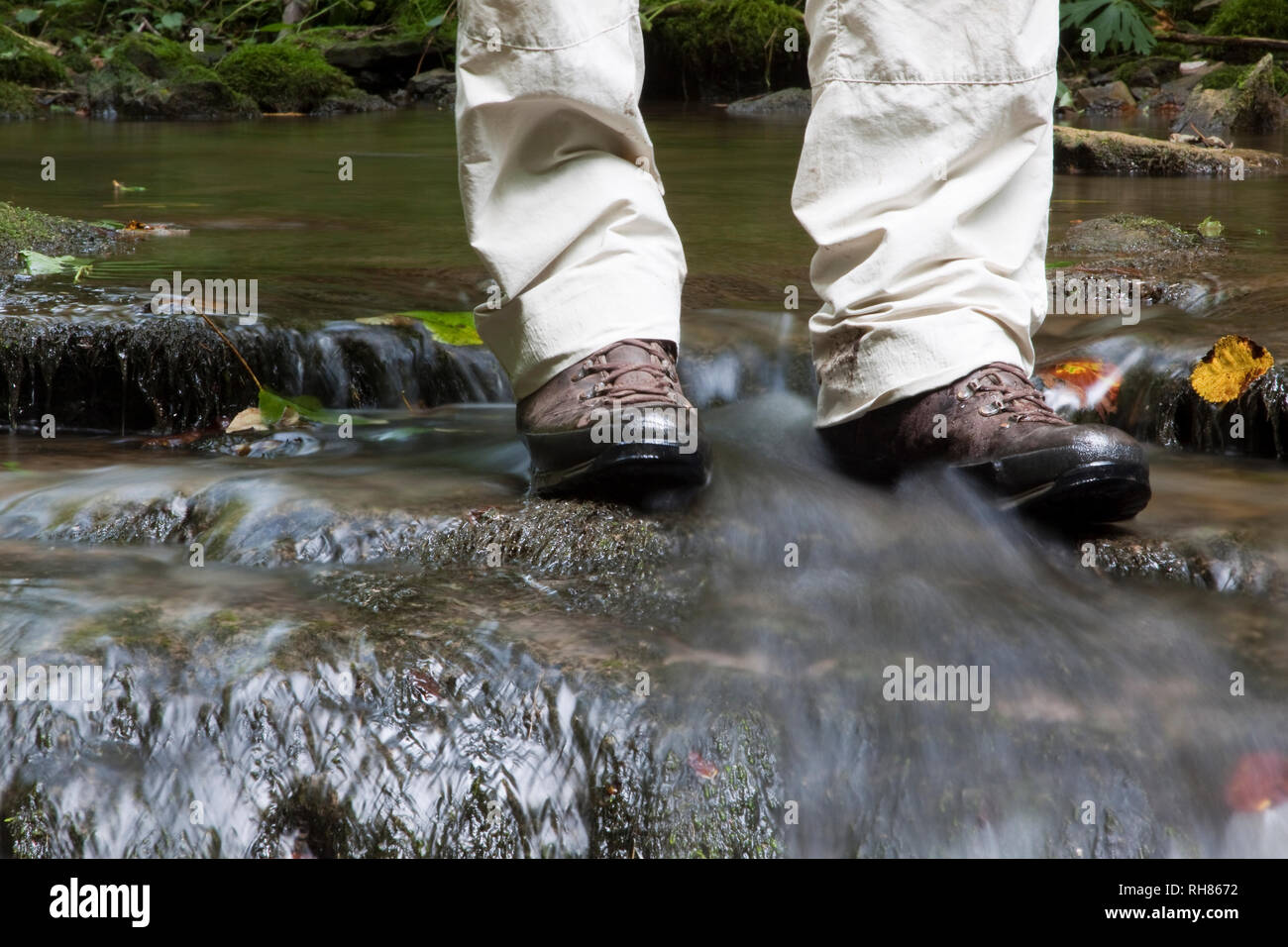 Hiker in Boots Standing in a River Stock Photo Alamy