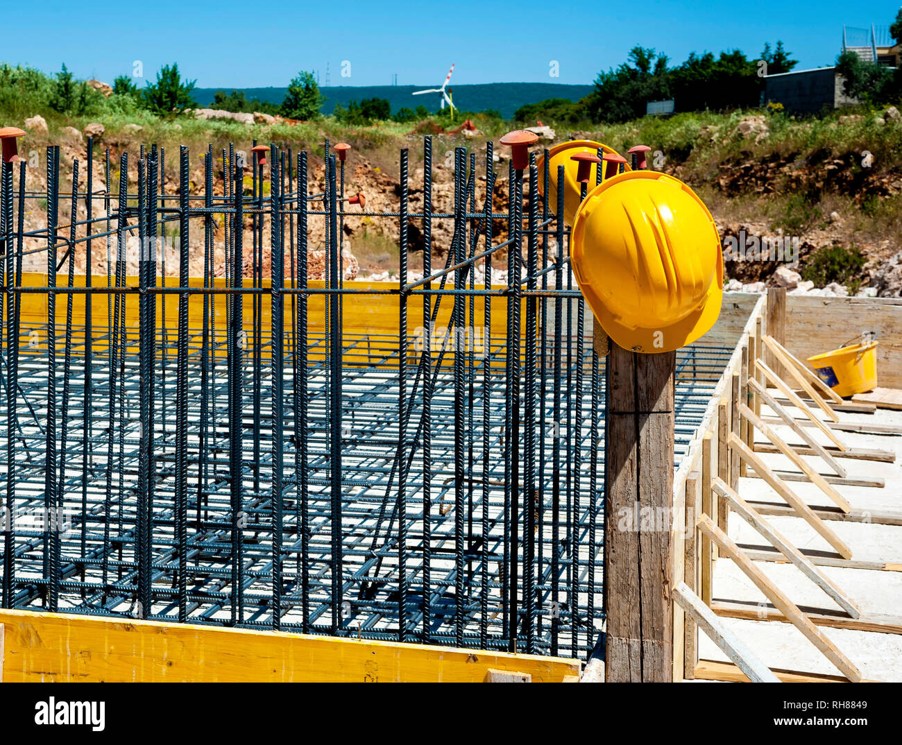 Helmet and protection caps for reinforcing bars on building site Stock Photo Alamy
