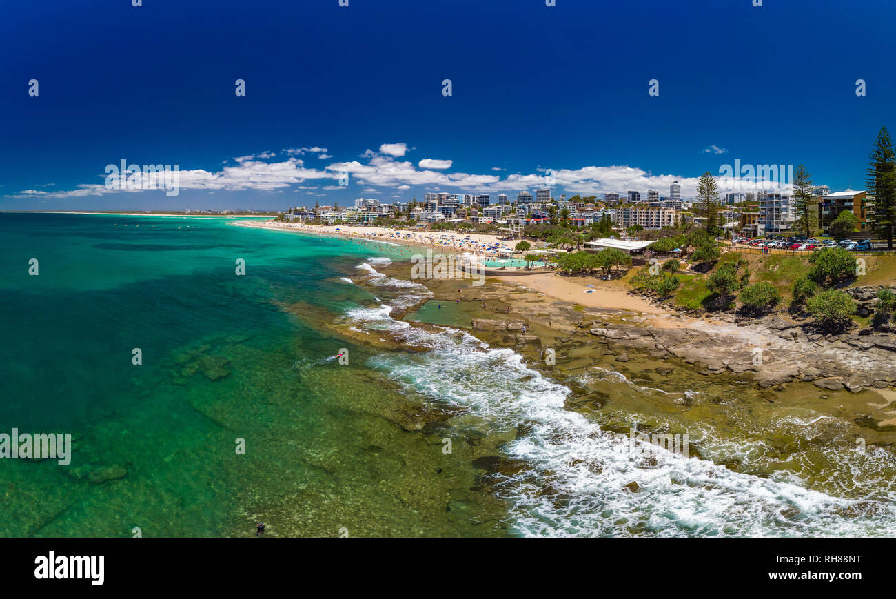 Aerial drone panoramic image of ocean waves on a busy Kings beach, Caloundra, Queensland, Australia Stock Photo