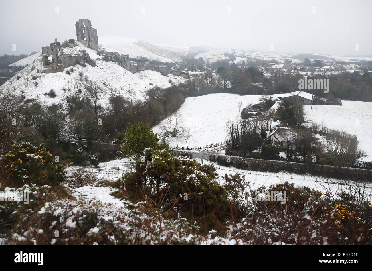 Snow covers the ground around Corfe Castle in Dorset. Snowfall and icy conditions are expected to cause widespread travel disruption after temperatures plummeted as low as minus 15.4C (4.3F) overnight. Stock Photo