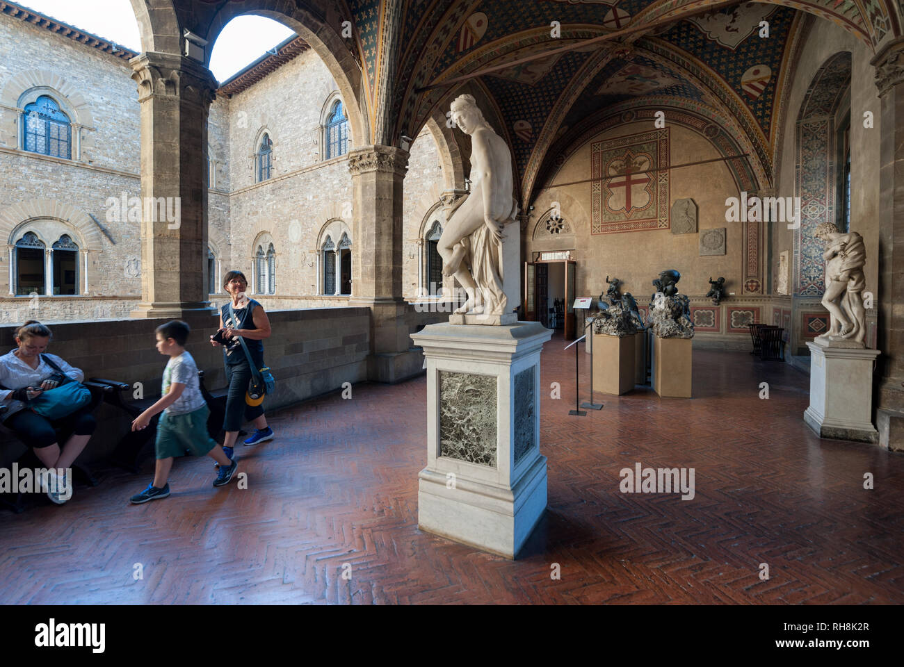 Florence, Italy - 2018, July 1: A view of the Loggia, on the first floor of the Bargello National Museum. Visitors admire the “Architecture” marble st Stock Photo