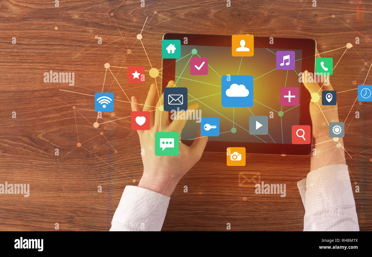 Hand touching multitask tablet with cloud wifi message social media ...