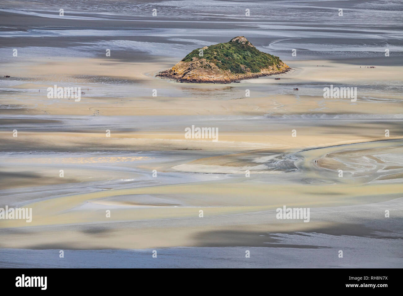 Aerial view of Tombelaine, small tidal island, at low tide, in the bay of Le Mont-Saint-Michel (St Michael's Mount) in Normandy, north-western France  Stock Photo