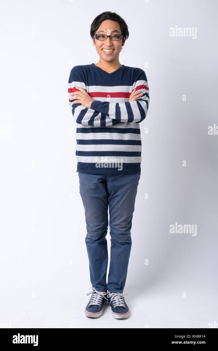 Full body shot of happy Japanese man smiling with arms crossed Stock ...