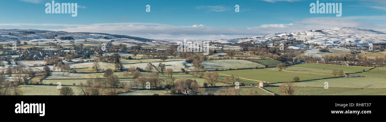 North Pennines AONB panoramic landscape, view from Whistle Crag over Teesdale into Lunedale with snow covered hills in the distance in bright winter s Stock Photo