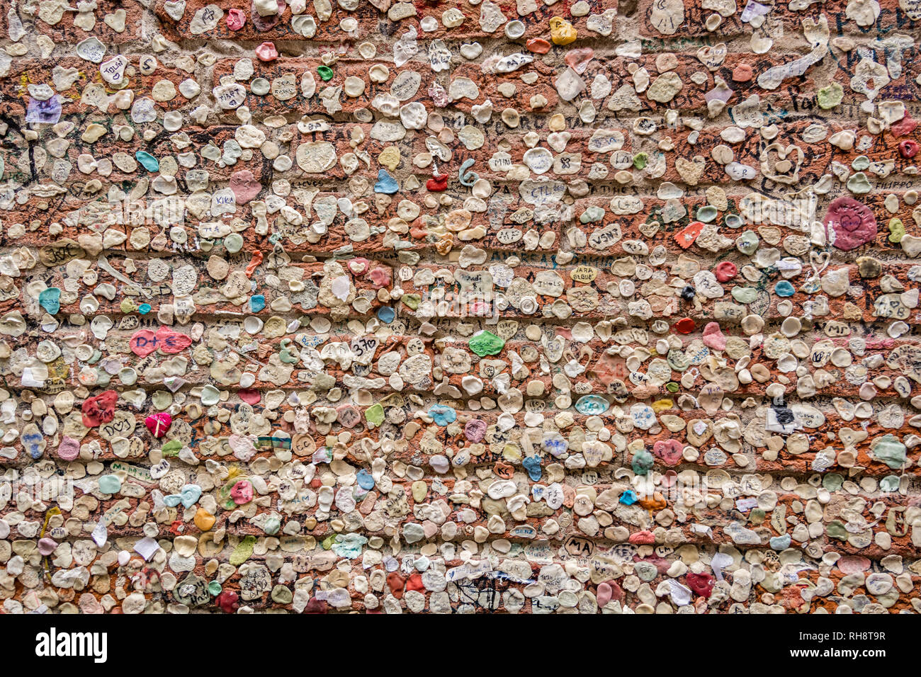 A wall in Verona covered with gum, Italy Stock Photo