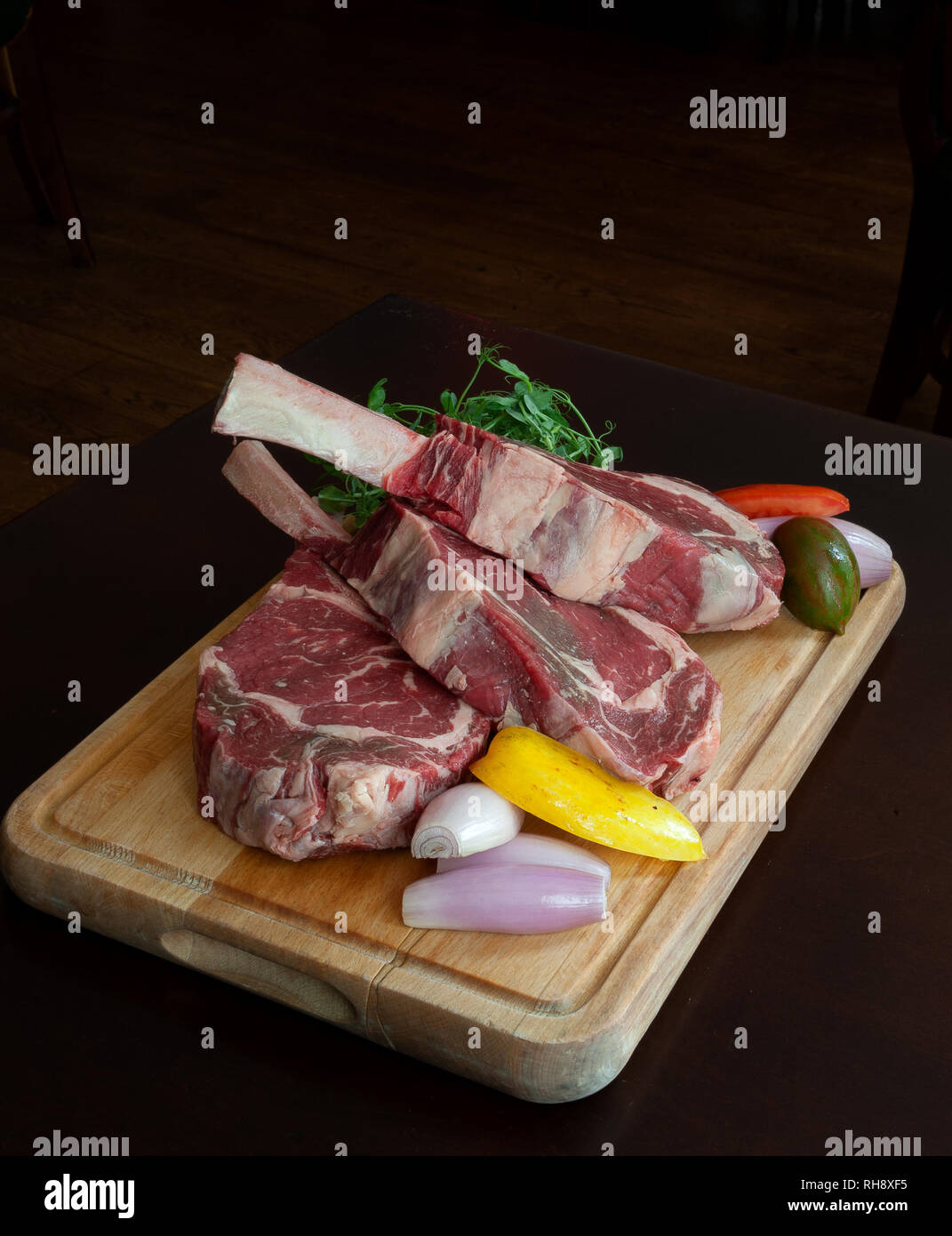 Tomahawk Steaks ready to Cook. Stock Photo