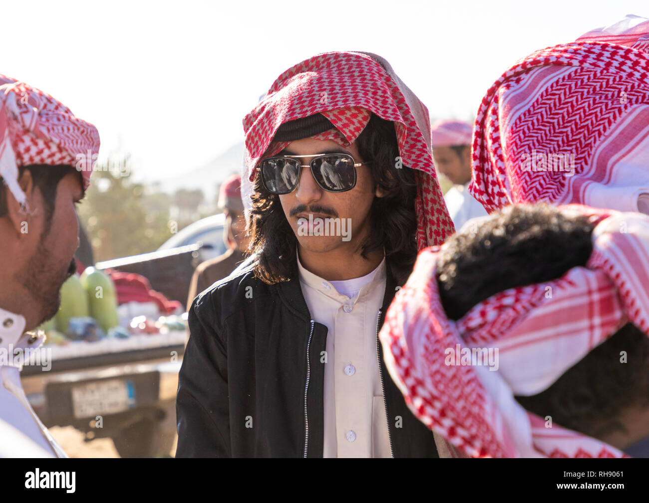 Saudi young men with keffiehs and sunglasses, Najran Province, Najran, Saudi  Arabia Stock Photo - Alamy