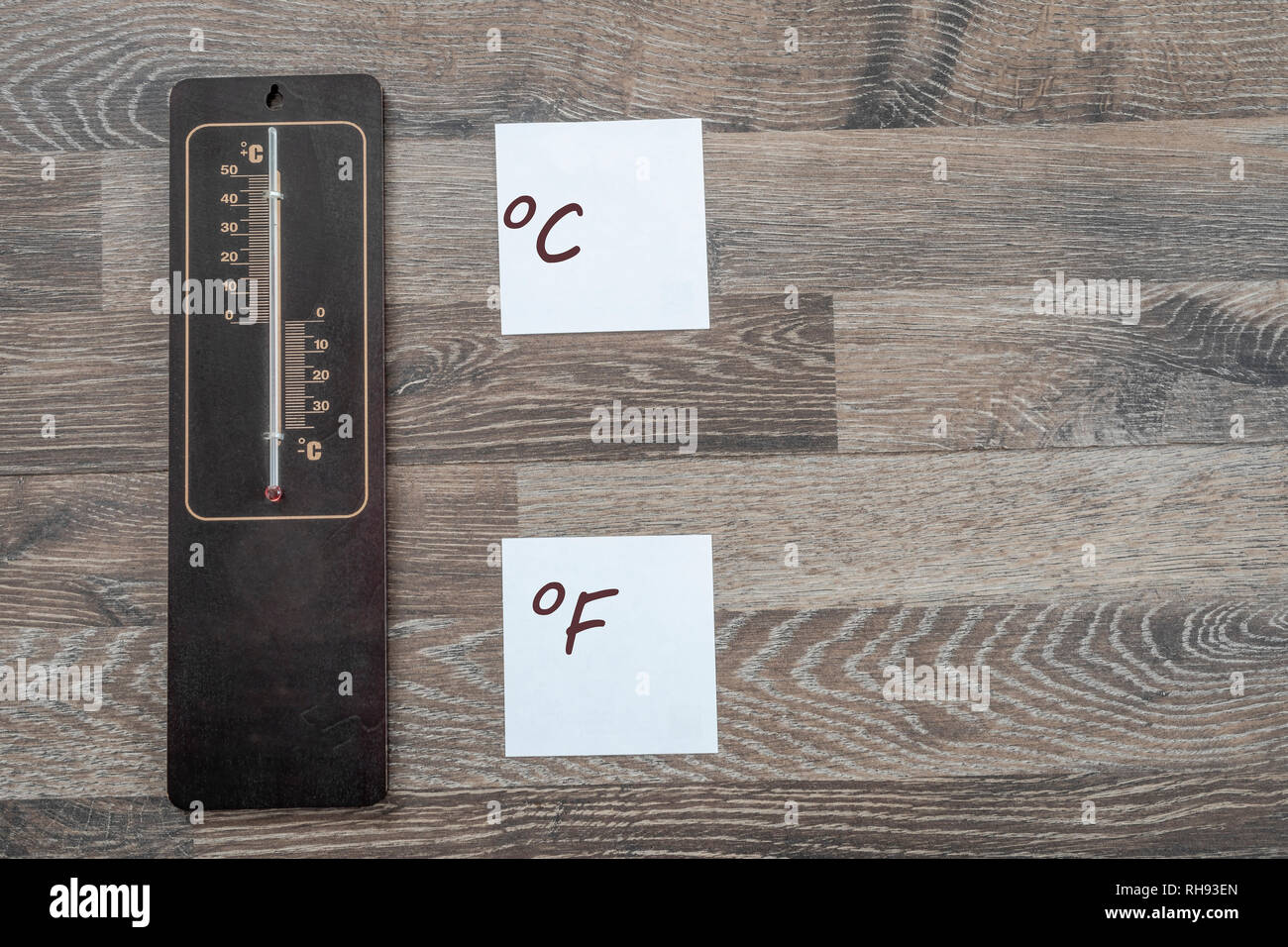 Wooden thermometer for measuring the outside temperature that shows the value in celsius Stock Photo