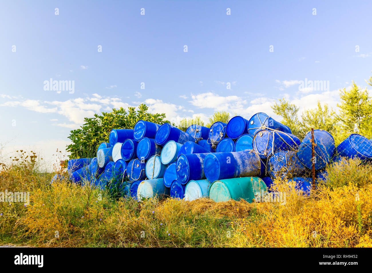 Stockpile of used blue plastic drums for storing water and other liquids Stock Photo Alamy