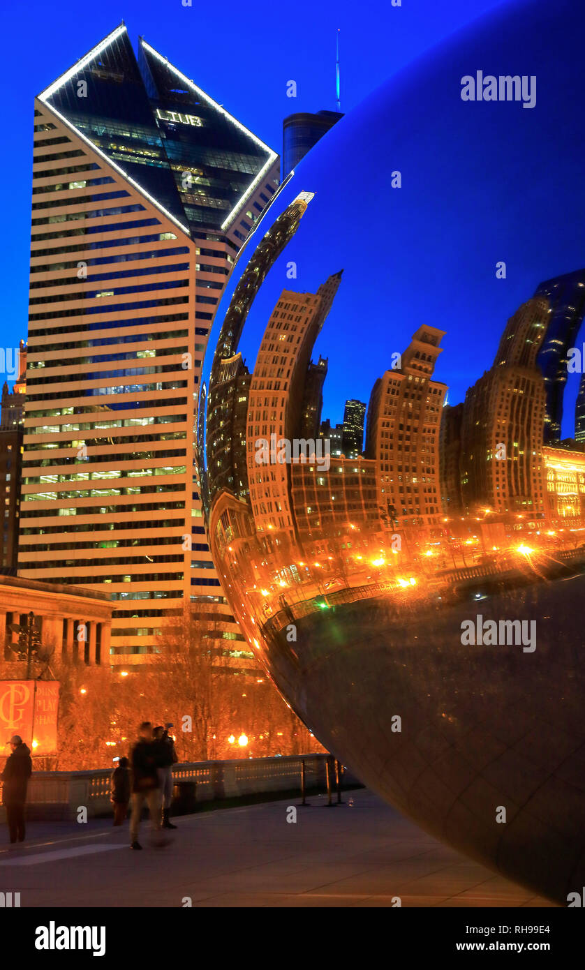 A closed up night view of Chicago skyline reflection on Cloud Gate aka