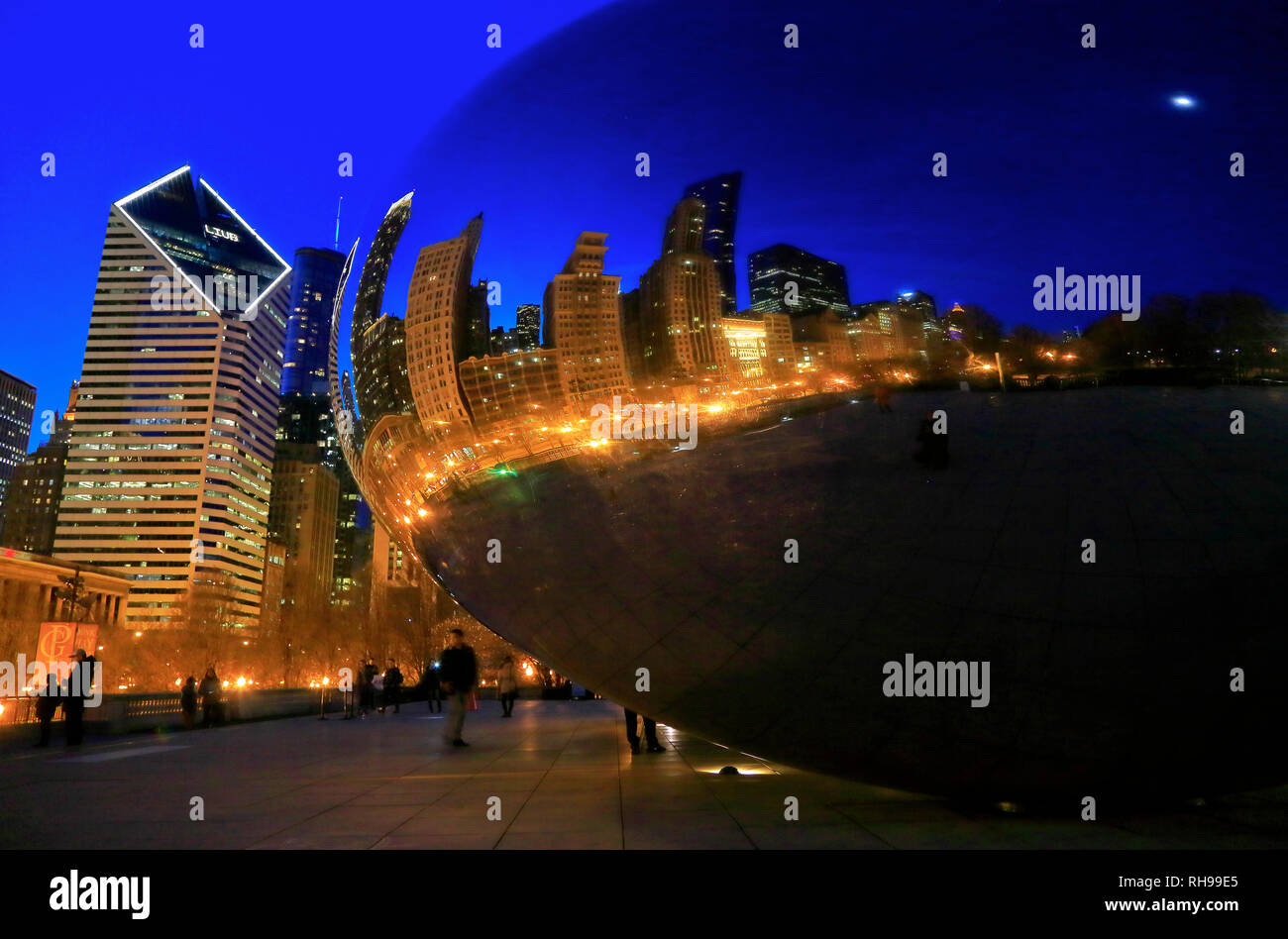 A closed up night view of Chicago skyline reflection on Cloud Gate aka