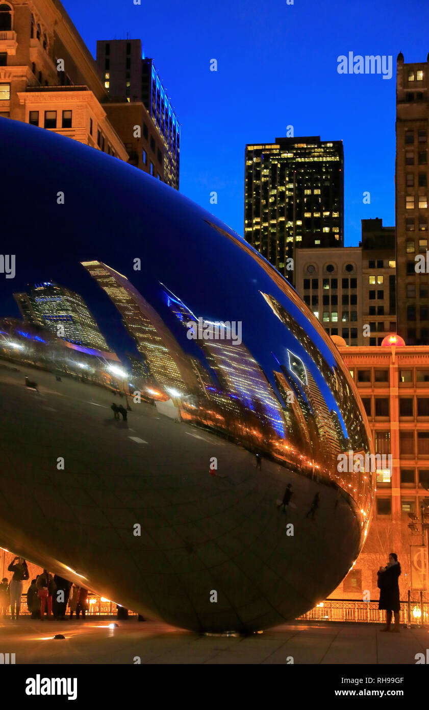 A closed up night view of Chicago skyline reflection on Cloud Gate aka
