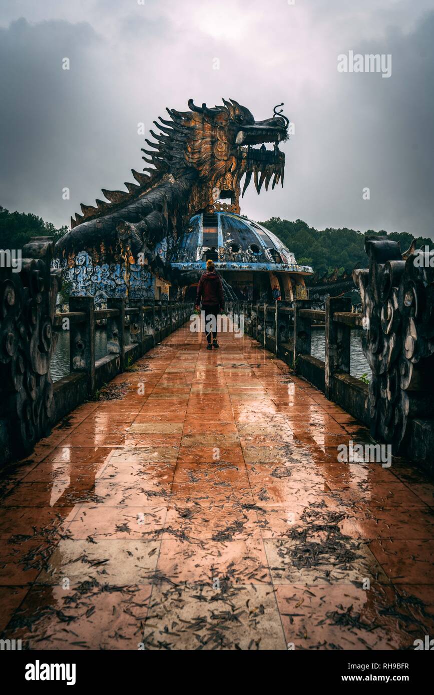 Dark tourism attraction Ho Thuy Tien abandoned waterpark, close to Hue city, Central Vietnam, Southeast Asia. Famous Dragon statue in the middle of th Stock Photo