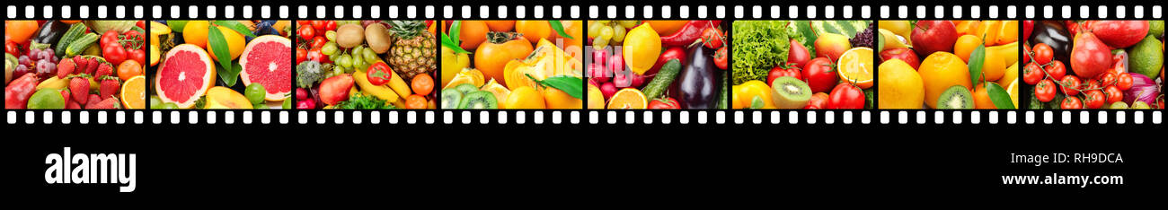 Wide frame in form of film strip with fresh fruits and vegetables. Stock Photo