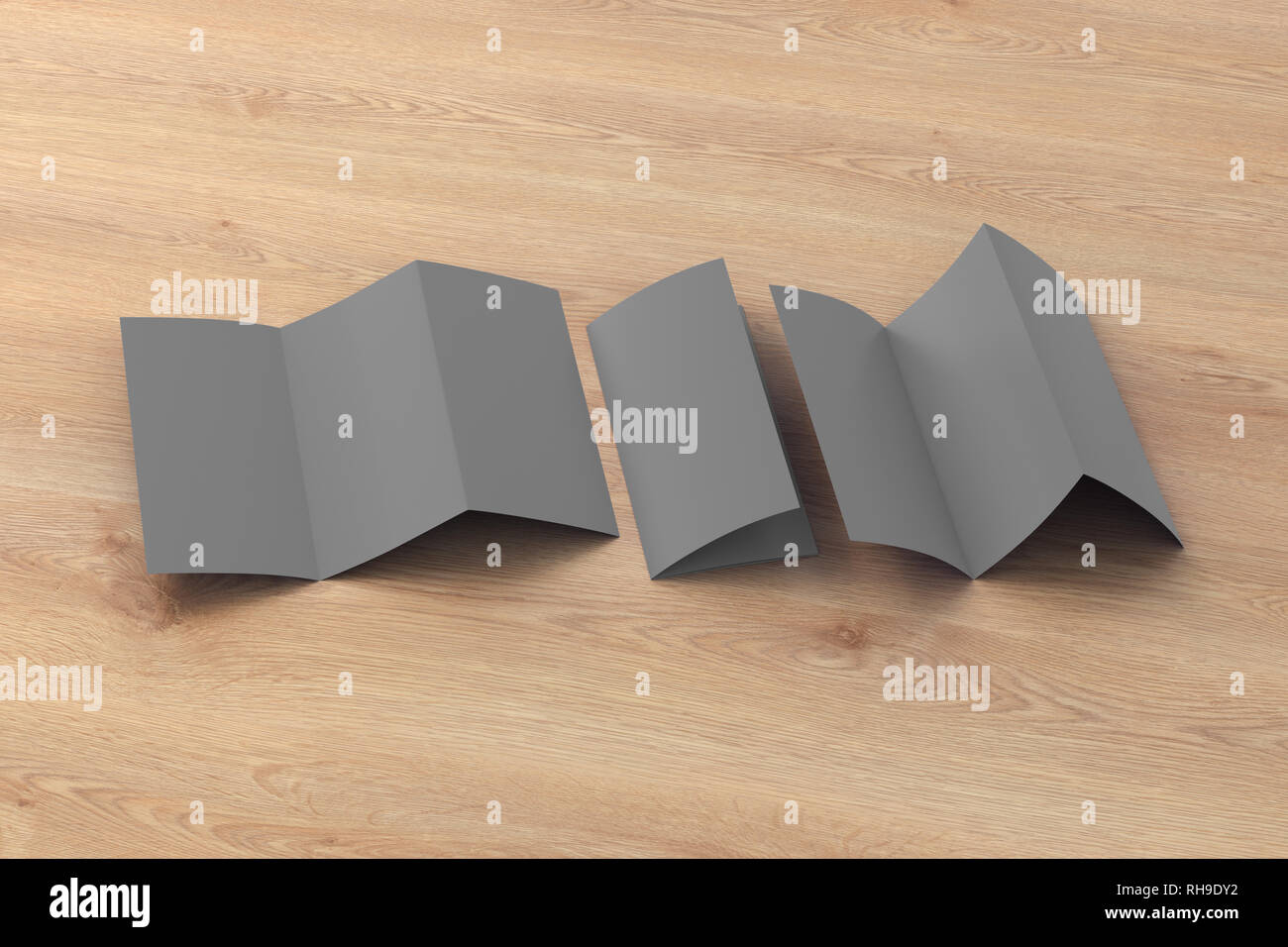 Blank gray trifold paper leaflet on wooden background. Six pages, three ...