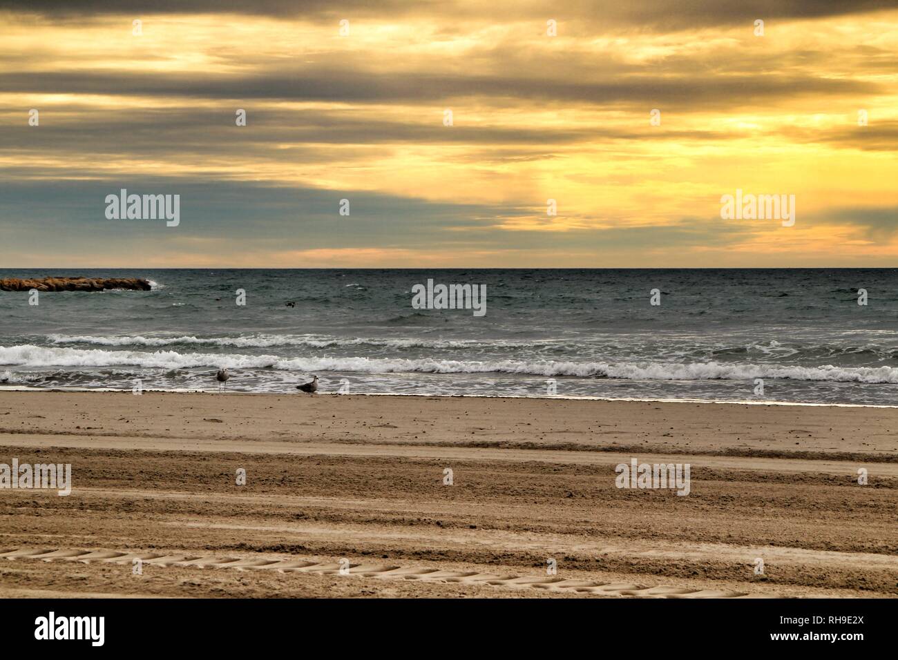 Beach Under Golden Stormy Sky In Santa Pola Alicante Spain Stock Photo Alamy