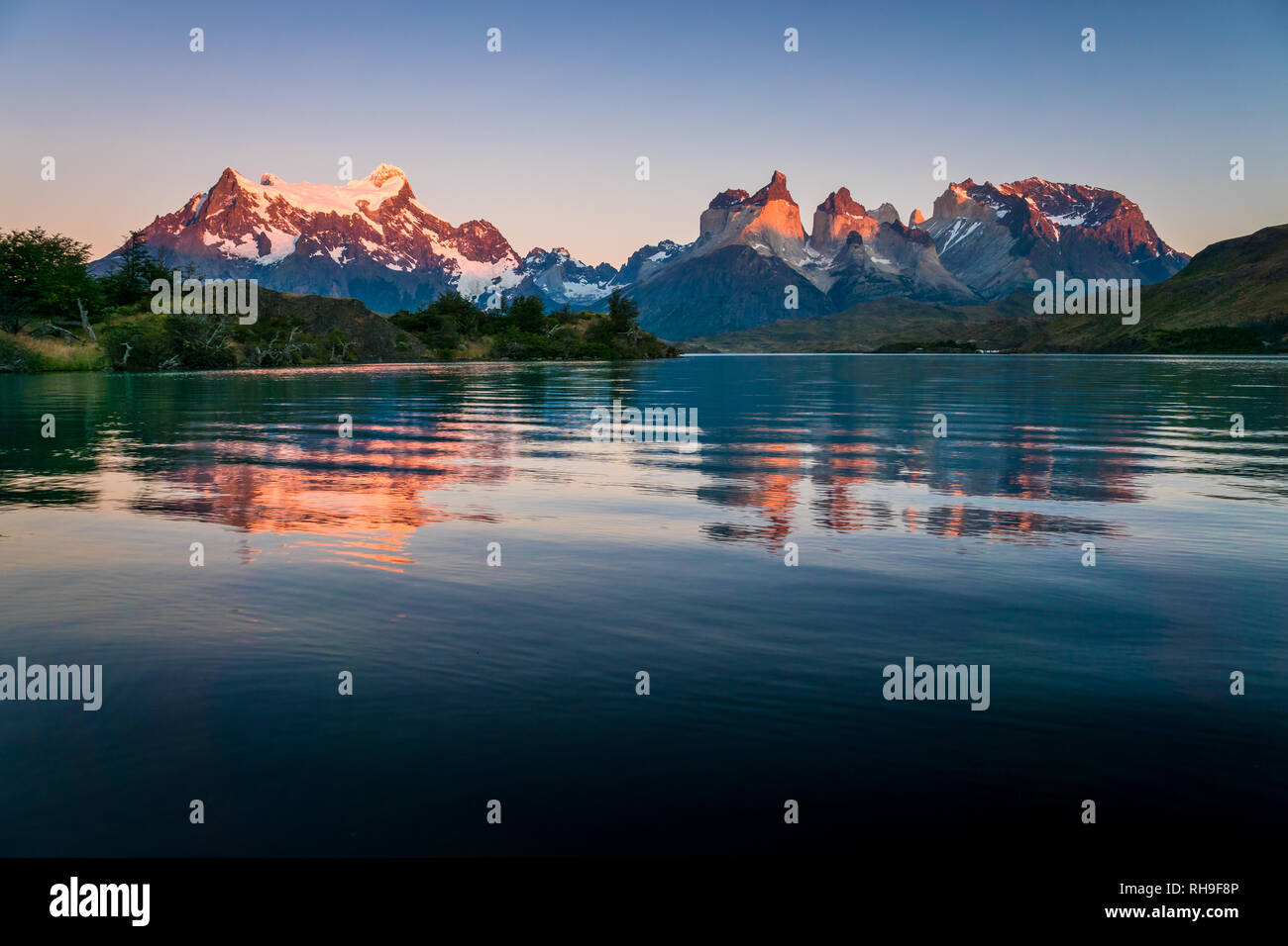 morning light on the Torres del Paine with Lago Pehoé in Front which reflects the wonderful scene Stock Photo