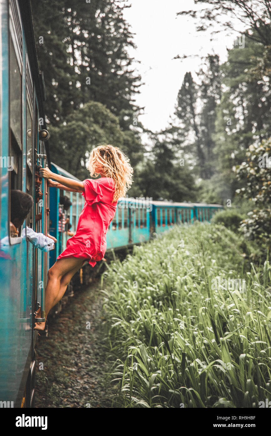 Kandy to Ella train ride, Sri Lanka. Girl on train. Stock Photo