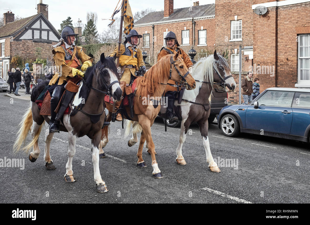 Members of the Sealed Knot ride down Welsh Row at the 2019 battle of Nantwich re-enactment Stock Photo