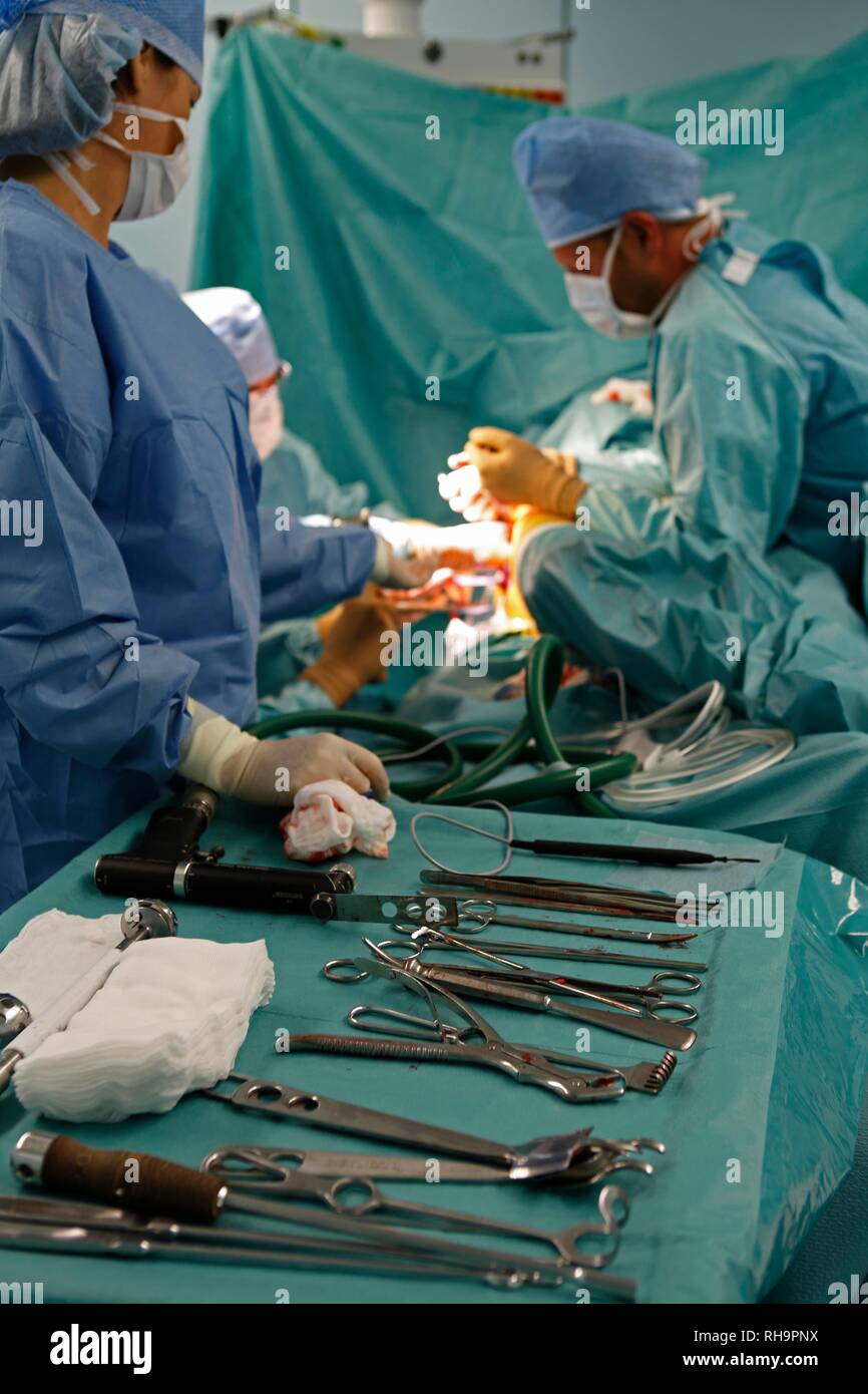 Surgeons during surgery, total hip replacement, medical equipment, surgery department, hospital, Czech Republic Stock Photo