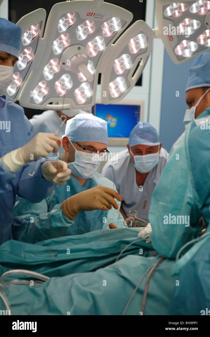 Surgeons during surgery, surgical department, hospital, Czech Republic Stock Photo