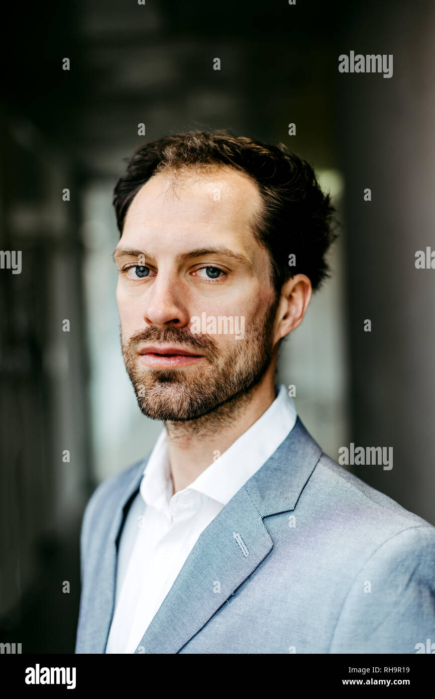 serious businessman looking into the camera Stock Photo