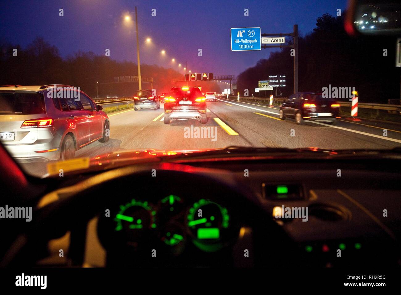 View from car to traffic, motorway at dusk, A7, Hamburg, Germany Stock Photo