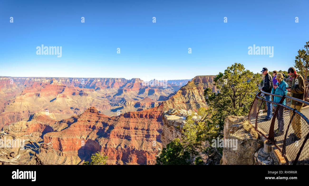 Tourists, visitors at Mather Point, eroded rocky landscape, South Rim, Grand Canyon National Park, Arizona, USA Stock Photo