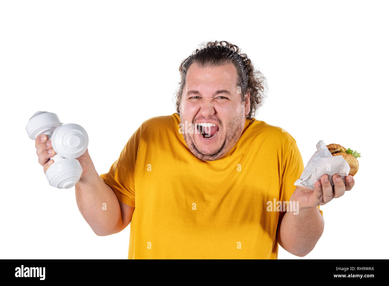 Funny fat man eating unhealthy food and trying to take exercise isolated Stock Photo