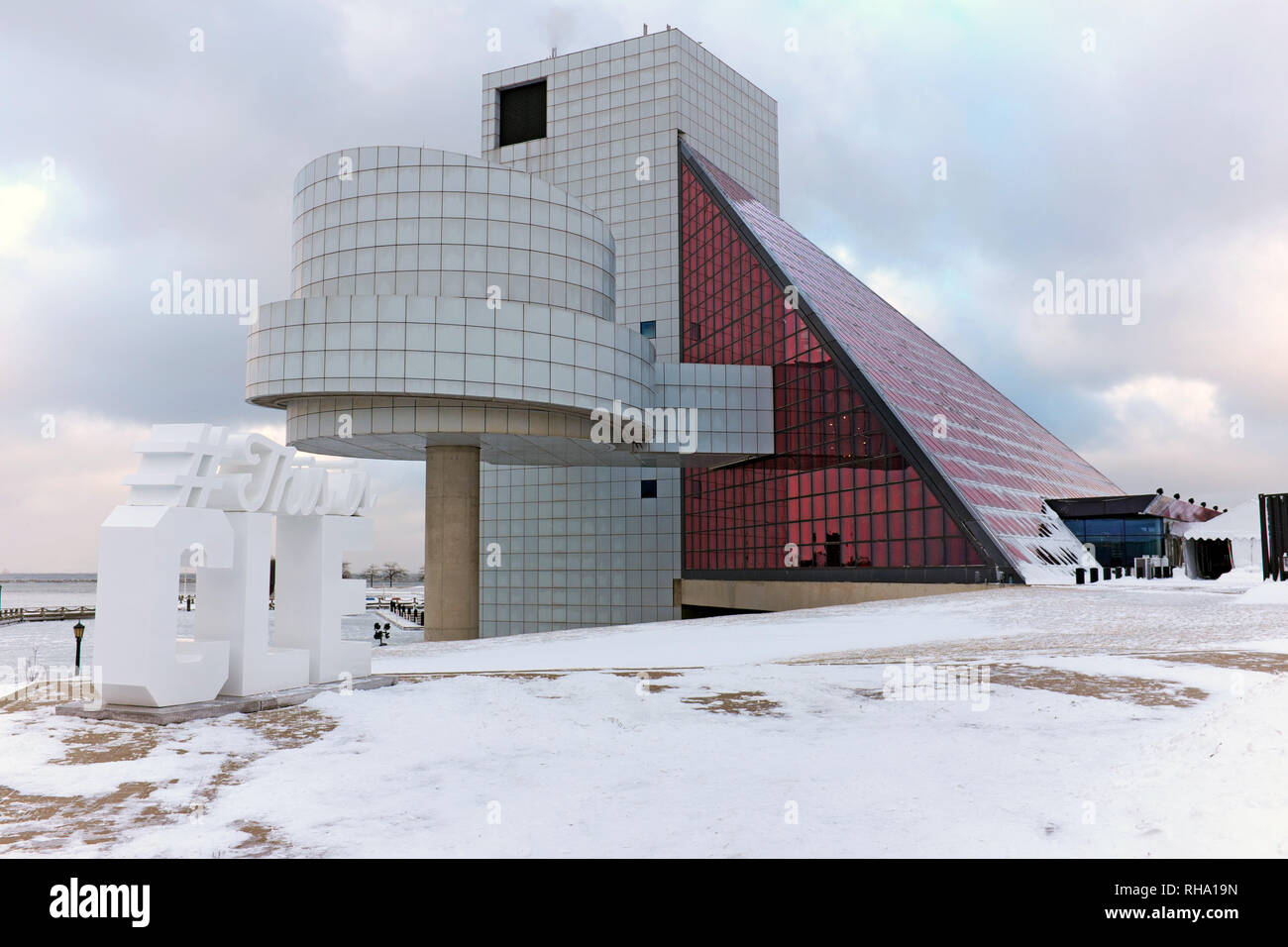The Northcoast Harbor winter weather in Cleveland Ohio brings snow to the Rock and Roll Hall of Fame and Museum, a major attraction on the lakefront. Stock Photo