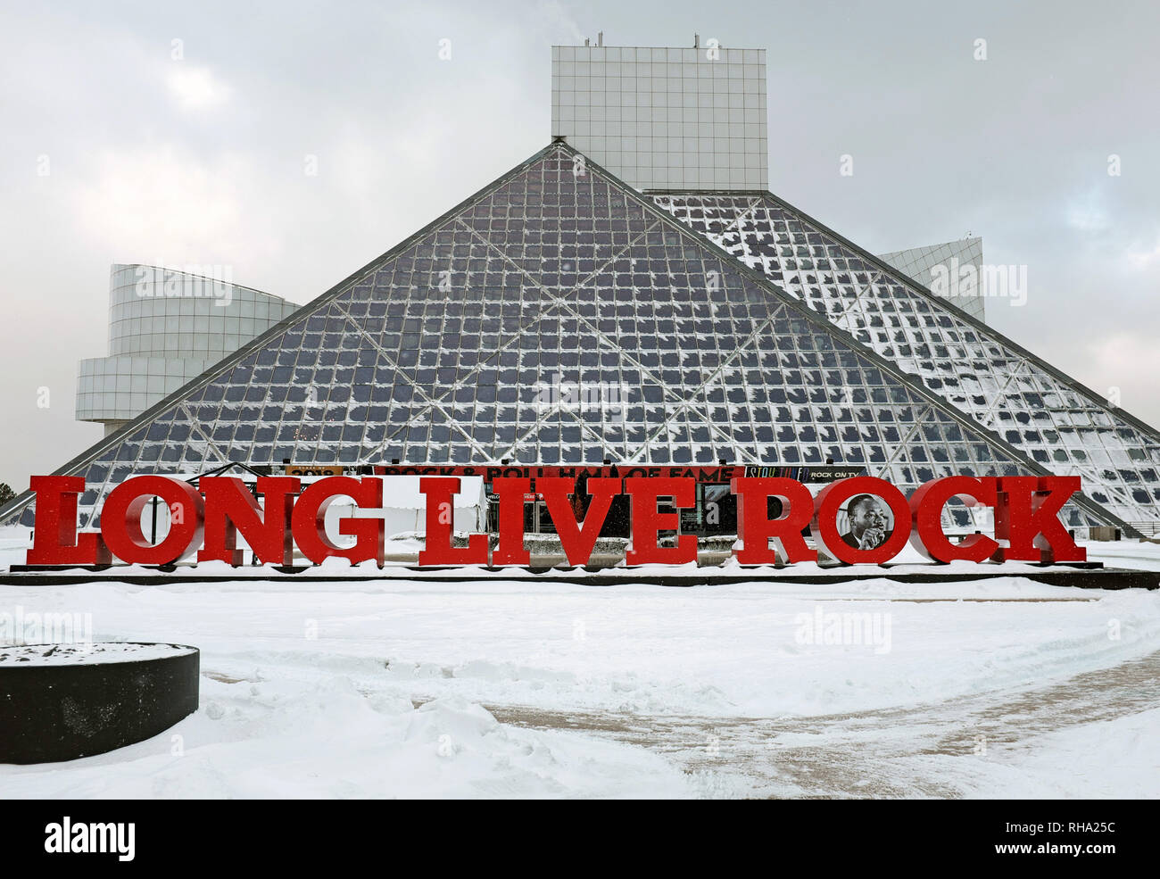 The Rock and Roll Hall of Fame in Cleveland, Ohio, USA after a winter storm with iced windows and a snowy plaza in front of the I.M. Pei building. Stock Photo