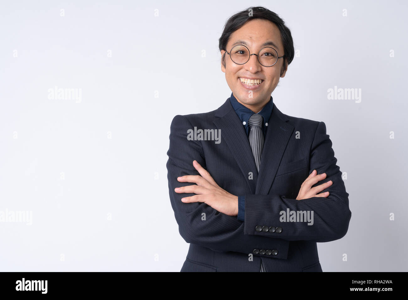 Portrait of happy Japanese businessman in suit with arms crossed Stock ...