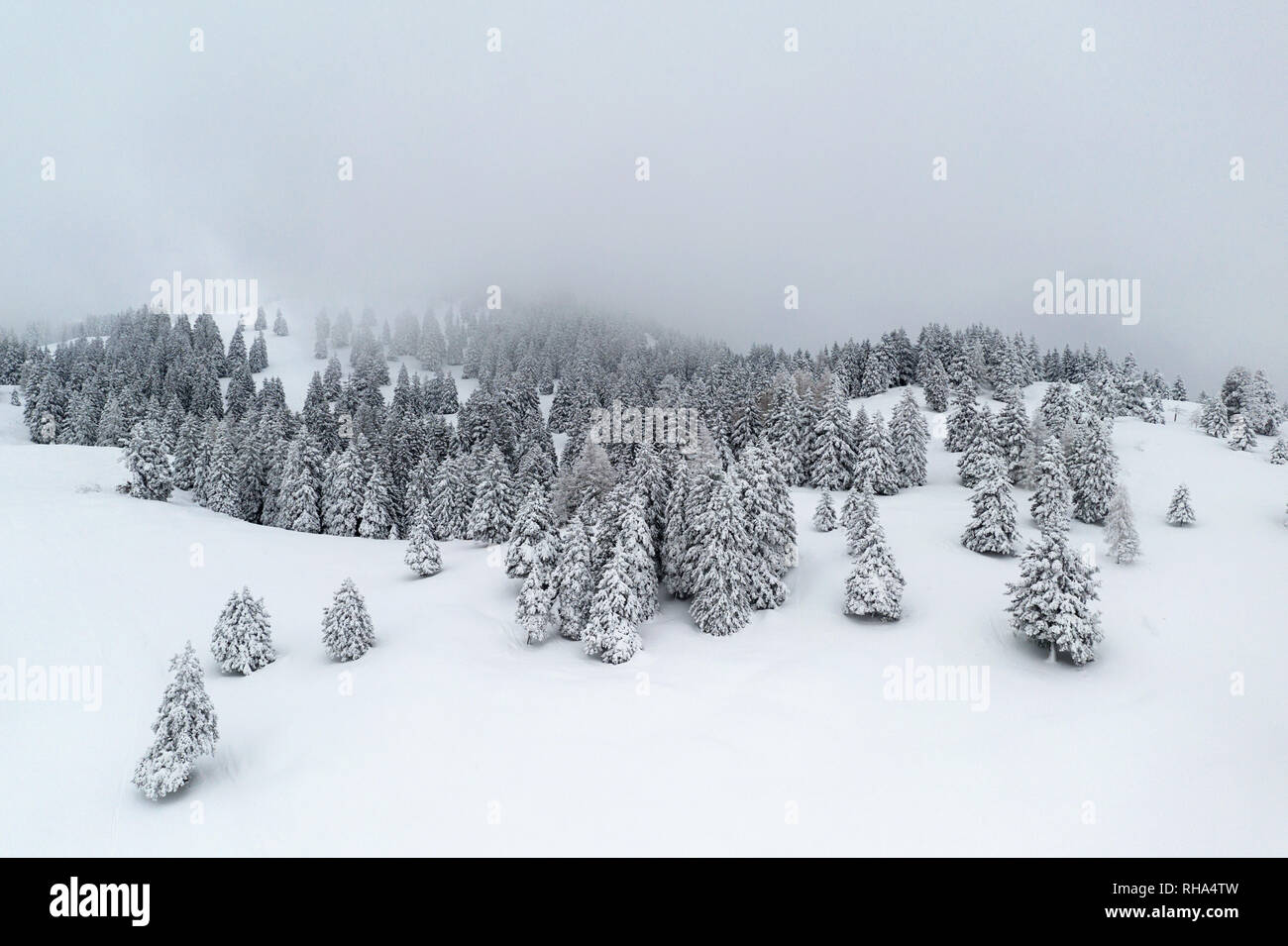 Aerial view of snow covered winter fairytale mountain landscape, taken by drone, Krvavec, Slovenia Stock Photo