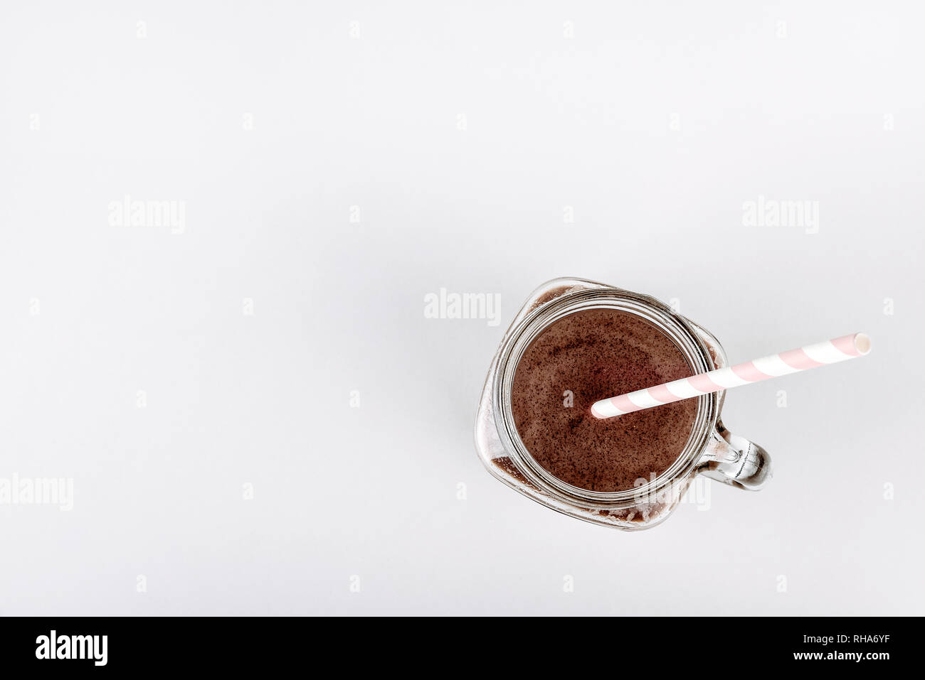 Protein shake, smoothie with chocolate and cocoa in a jar on a white background Stock Photo