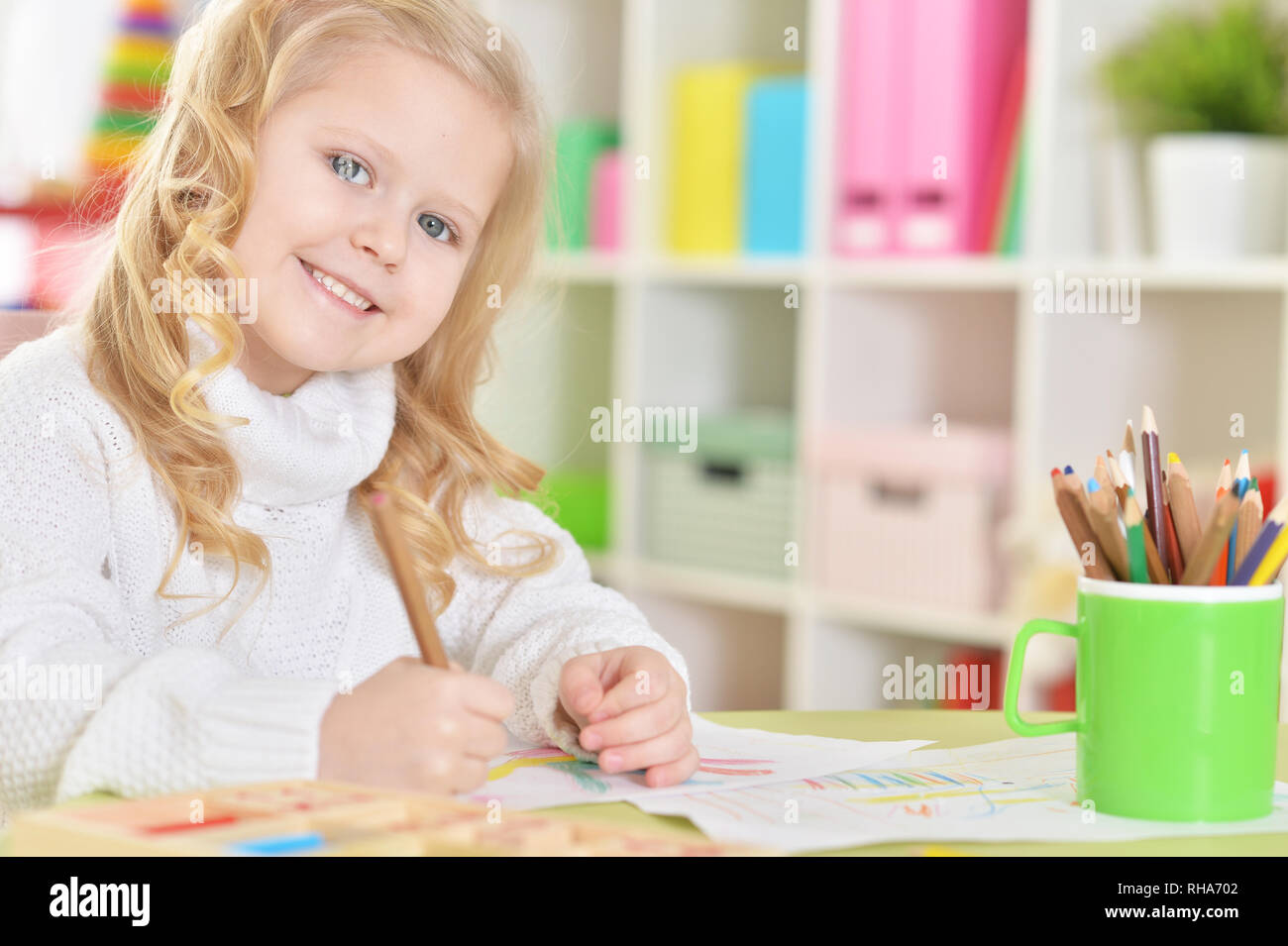 portrait of happy girl drawing with colorful pencils Stock Photo - Alamy