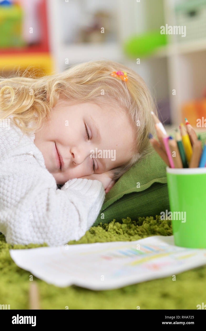 cute little girl sleeping on pillow on floor Stock Photo Alamy