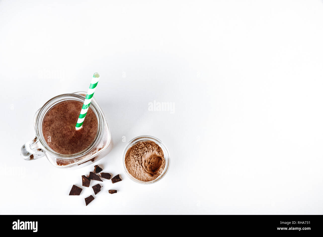 A glass of protein with cocoa and powder on a white background Stock Photo