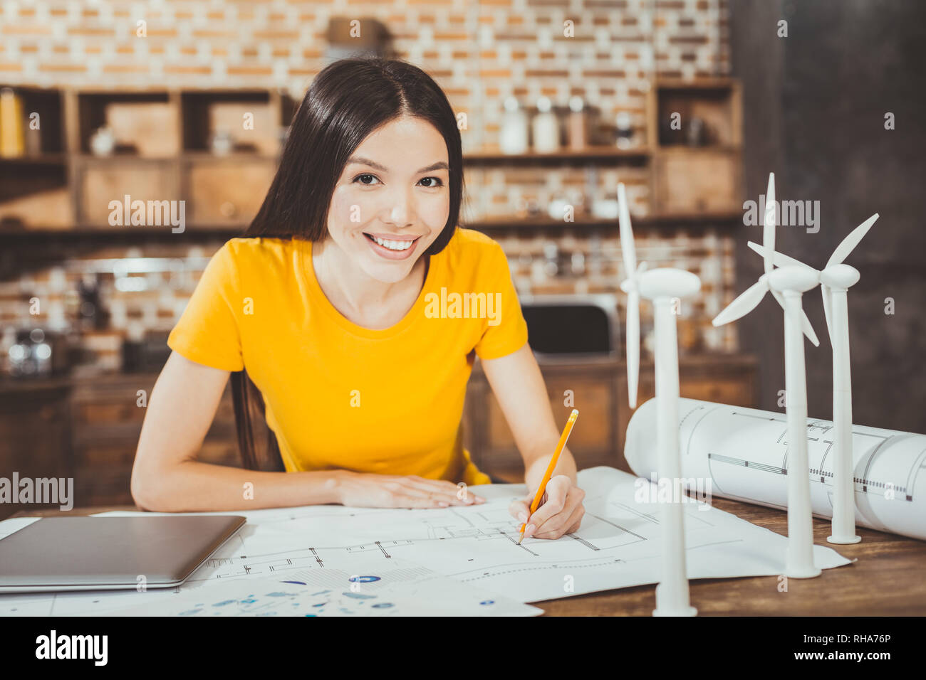 Pleased young woman looking straight at camera Stock Photo - Alamy