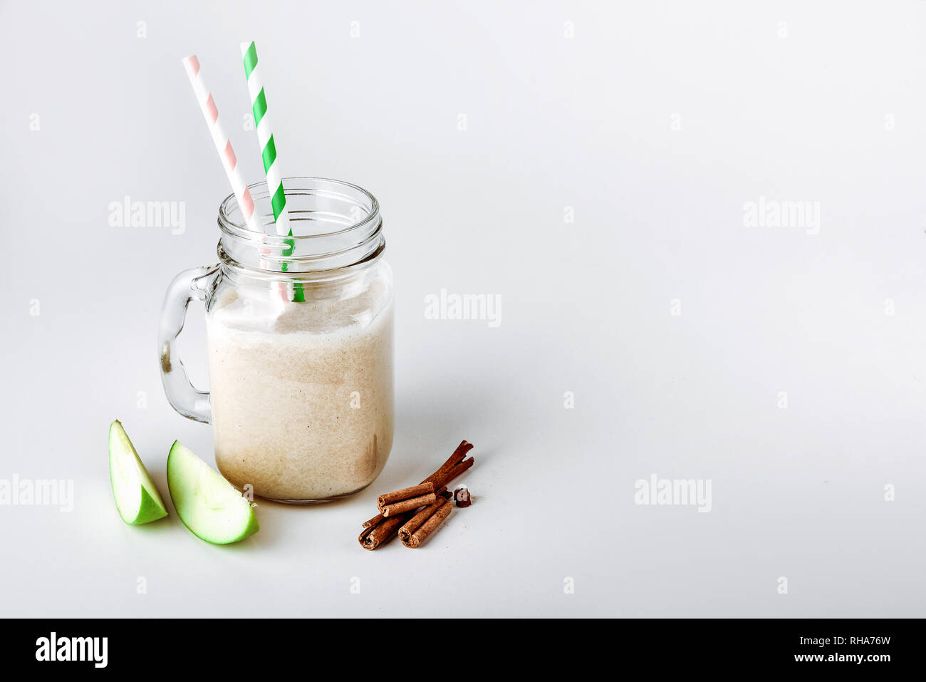 Cocktail protein, smoothie with apple, cinnamon in a glass. functional nutrition Stock Photo